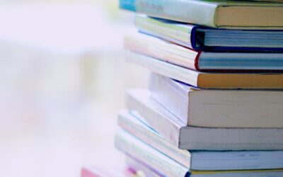 selective focus photo of pile of assorted title books